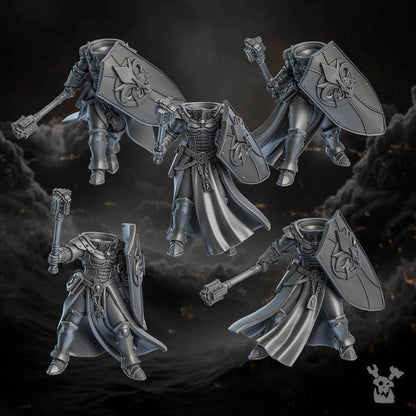 Four metallic fantasy warrior figurines on a dark background